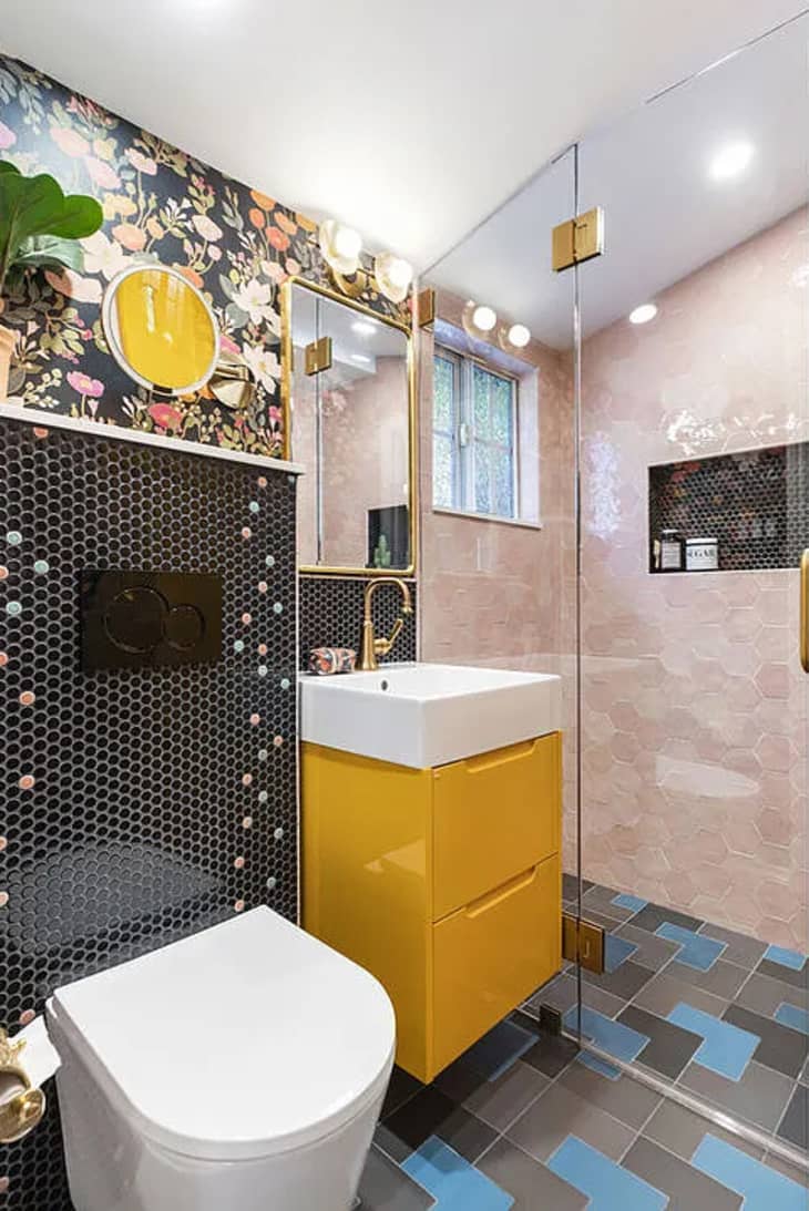 Bathroom with botanical floral wallpaper and yellow accents