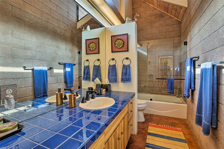 Bathroom with grey stone in New Mexico home.