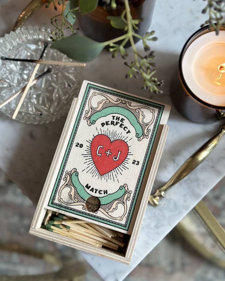 Custom matchbook given as engagement gift sitting on table