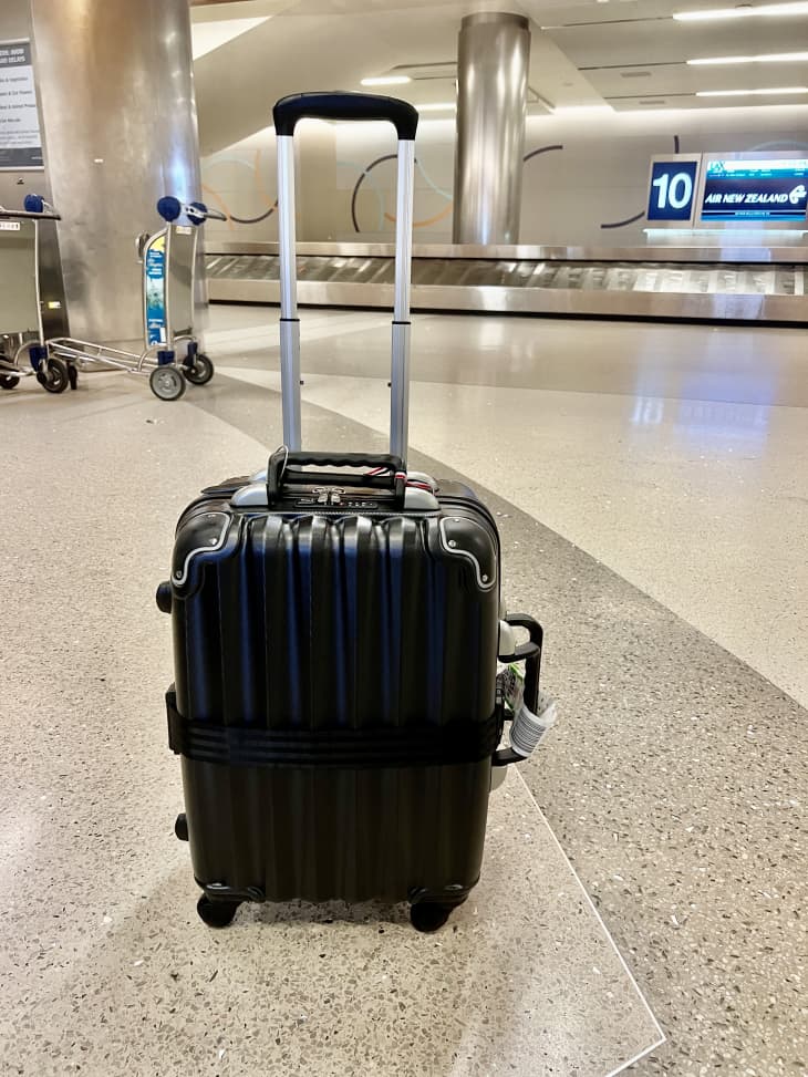 A black suitcase in an airport