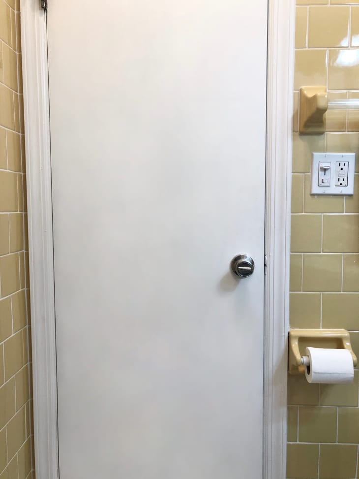 White painted door in a bathroom rental redo