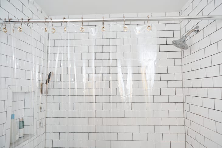 Clear shower curtain in classic bathroom