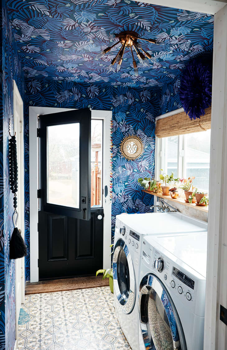 Laundry room with a wallpapered ceiling in the home of Shavonda Gardner