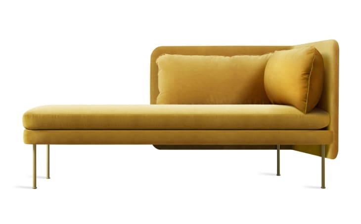 An ochre chaise lounge sofa