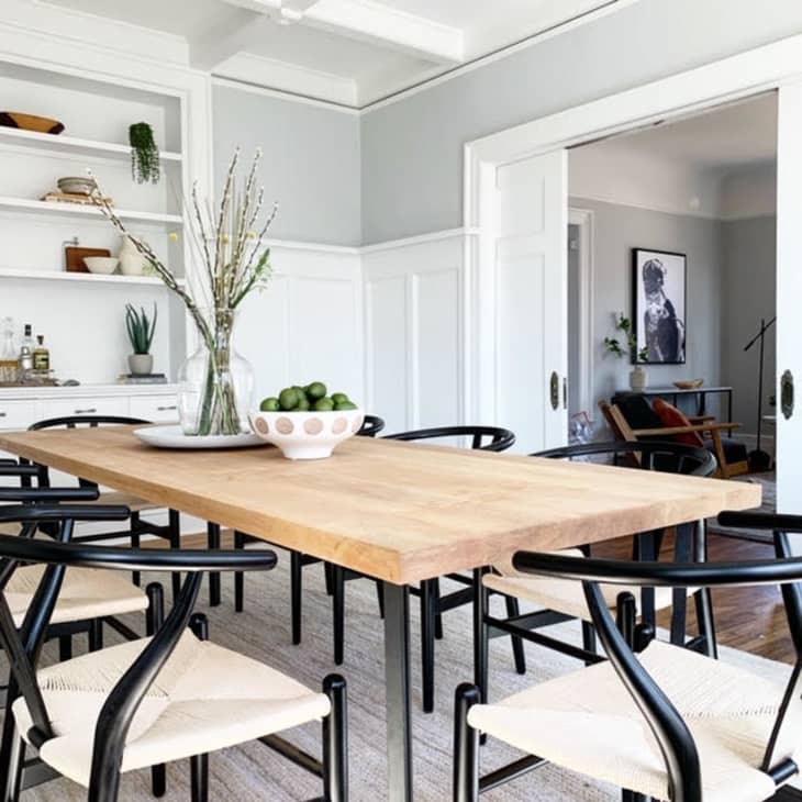 Scandinavian inspired dining area with Wishbone chairs in a high contrast hue
