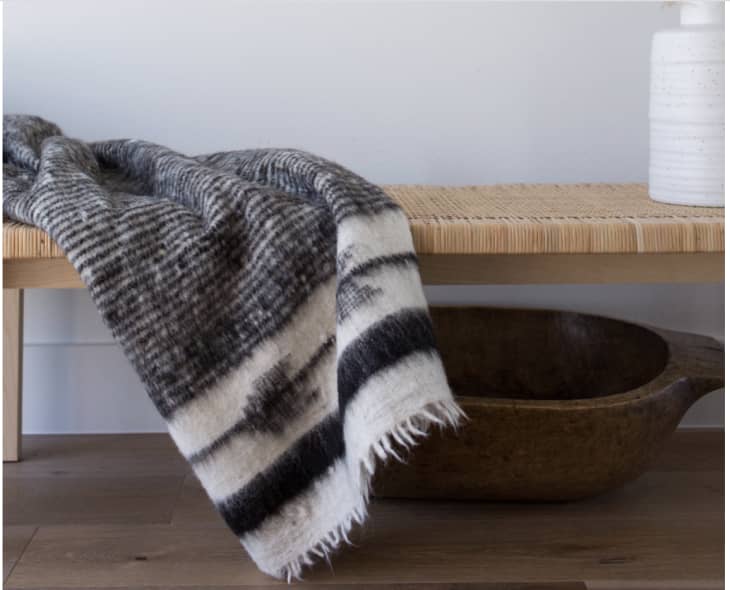 Thick woolen blanket on bench