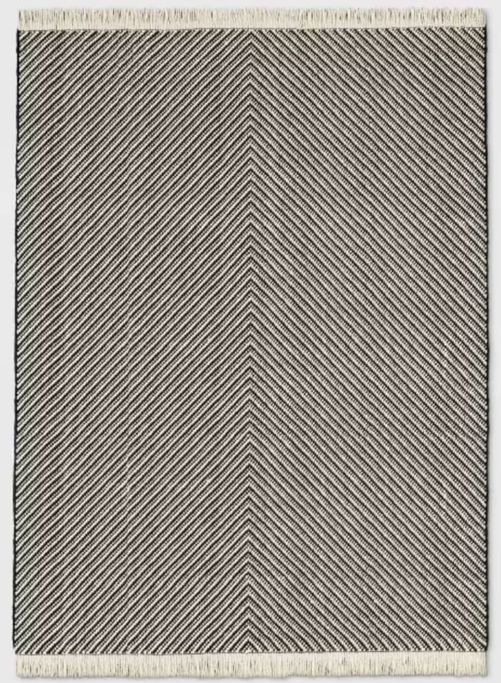 Woven chevron rug with fringe