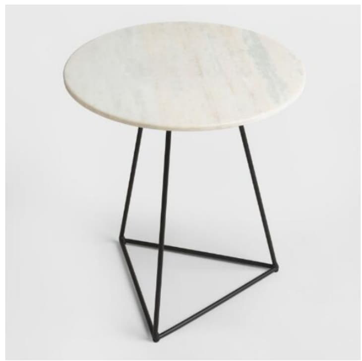 Accent table with white marble top and black triangle base