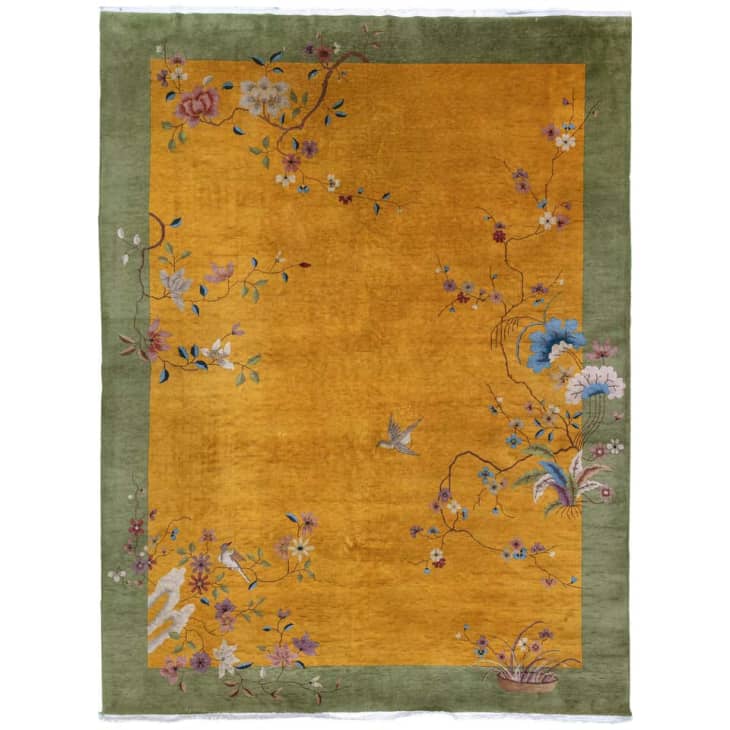 Chinese art deco rug in gold with a green border