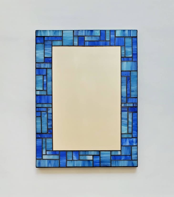 Rectangular mirror with blue stained glass frame