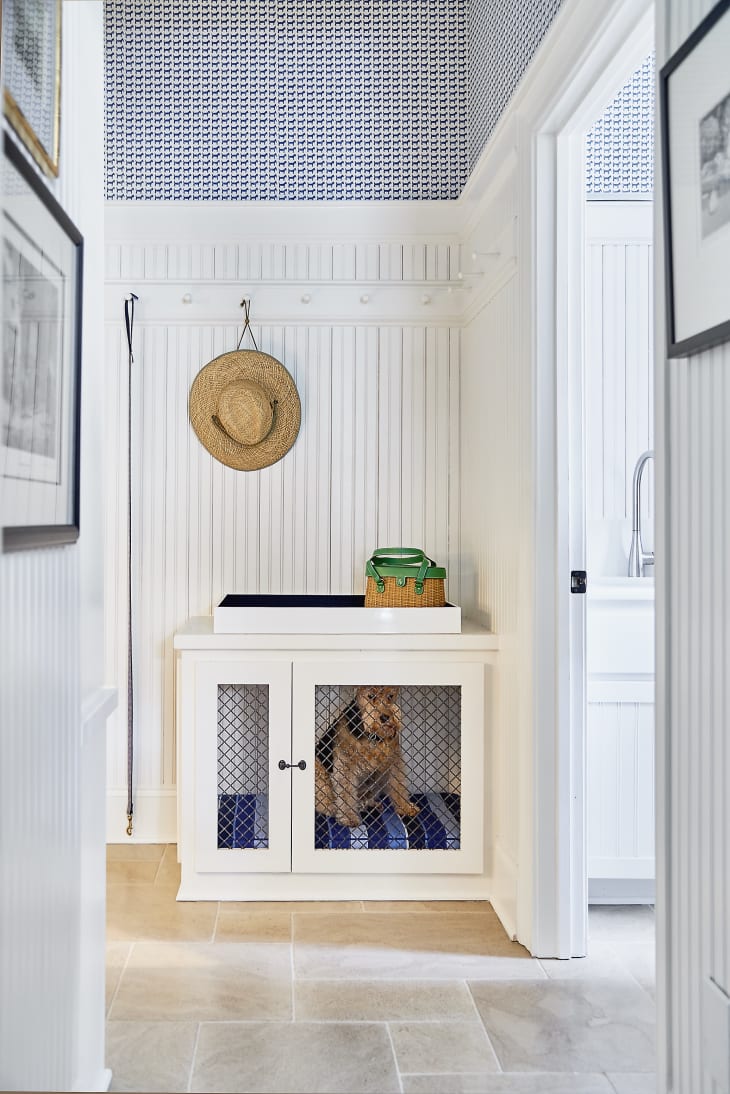 Hallway with dog crate that doubles as drop station for keys and bags