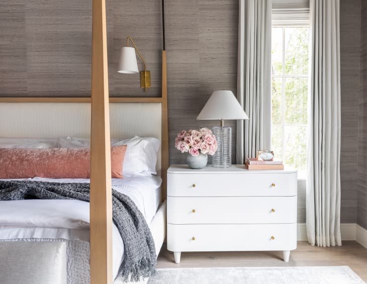 Calming bedroom with white bedding and furniture from Marie Flanigan Design