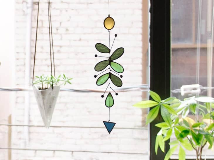 Stained glass mobile hanging in window