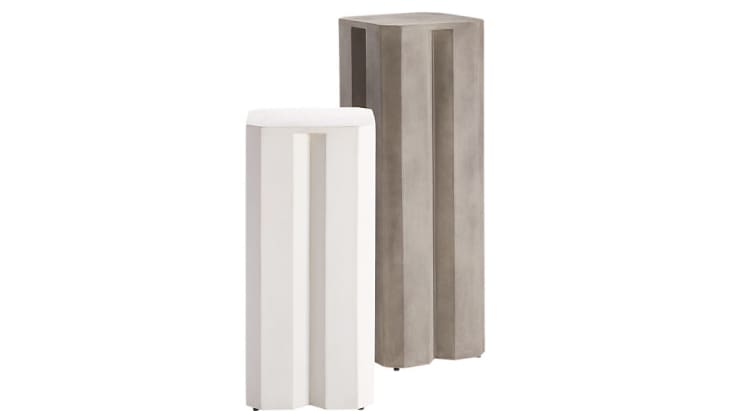 Cb2 fluted pedestal tables in white and gray