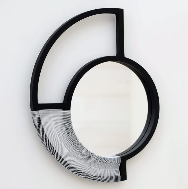 Abstract shaped mirror with woven detail