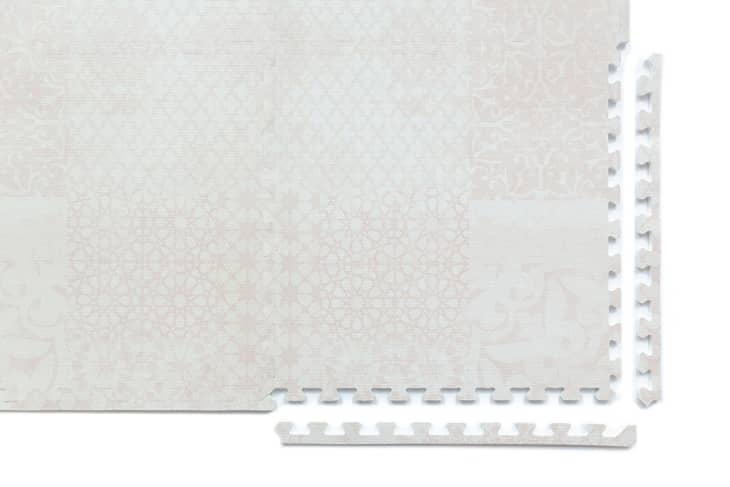 Subtly patterned cream and blush playmat