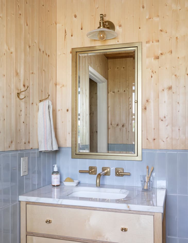 bathroom by Max Humphrey that features a medicine cabinet