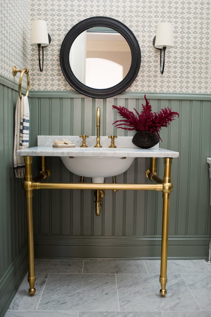 Bathroom with living brass finish by Whitney Parkinson