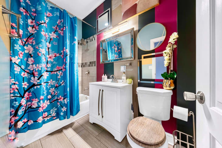 Bathroom with bold colors and floral shower curtain