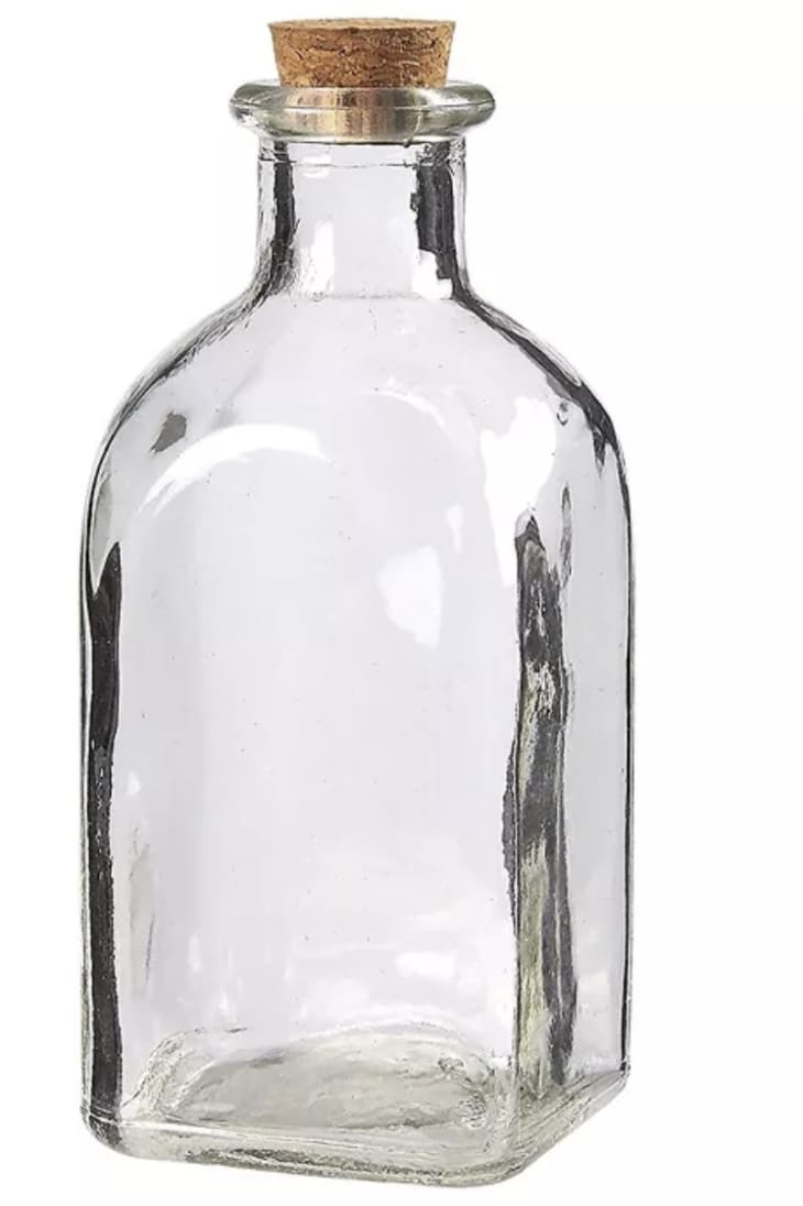glass bottle with a cork top