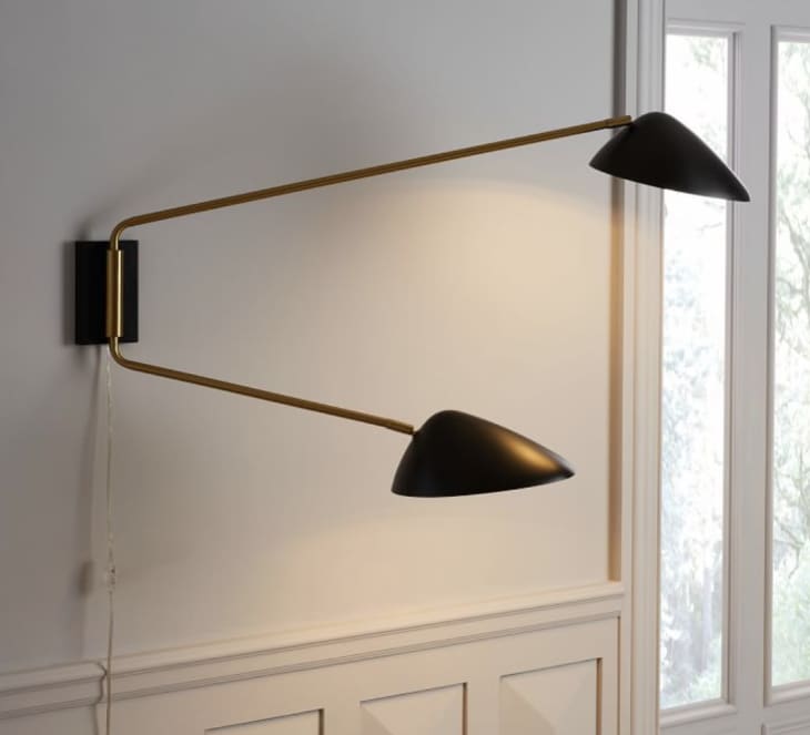 Black plug in swing arm sconces from West Elm