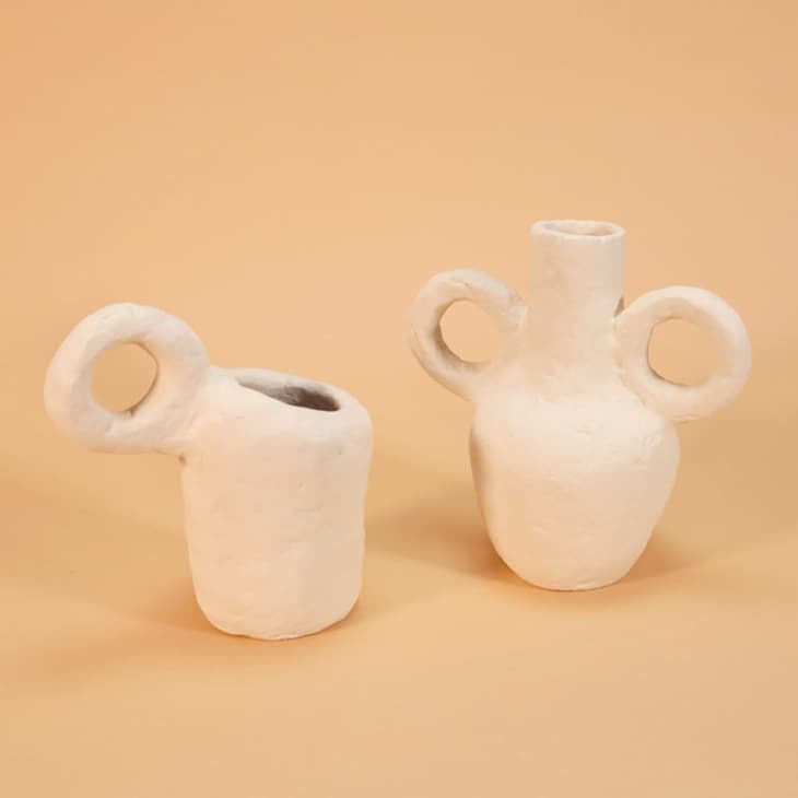 Cream-colored vases with large circular handles