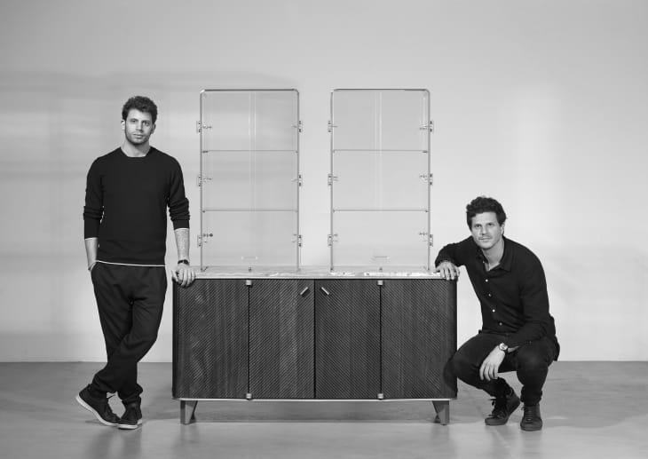 DAVID and NICOLAS designer portrait with their monocle bar cabinet in black and white