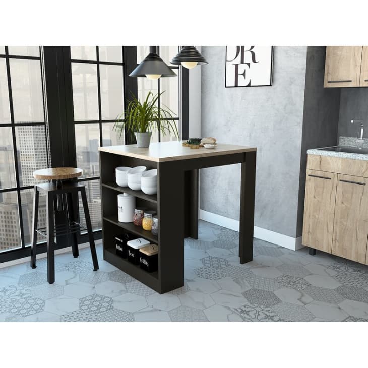 Kitchen island with a built in shelf in black from Wayfair