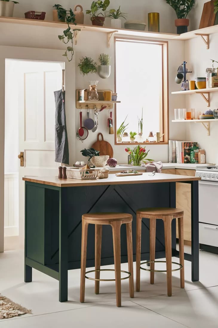 Grayson kitchen island from Urban Outfitters with a green base