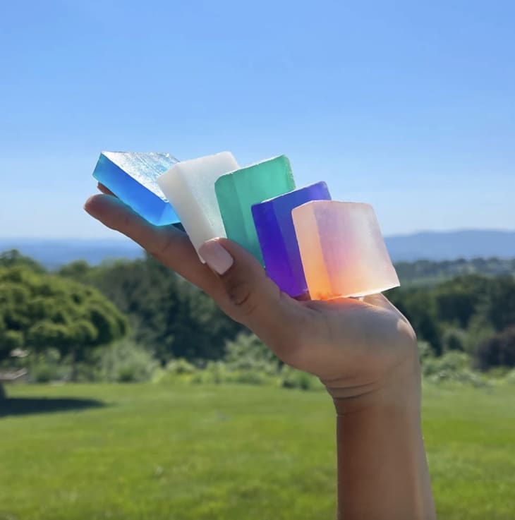 Neon Bars Soap 5 pack in maker's hand