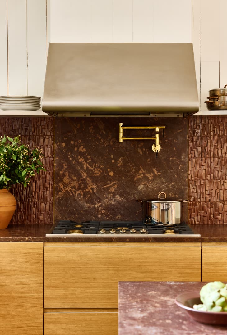 Montauk kitchen featuring red stone designed by Studio McKinley