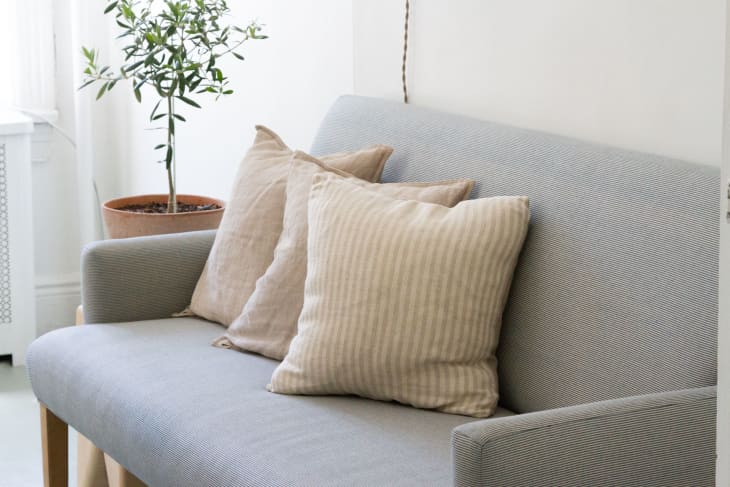 Erin Boyle's blue and white striped sofa that will get visibly mended one day