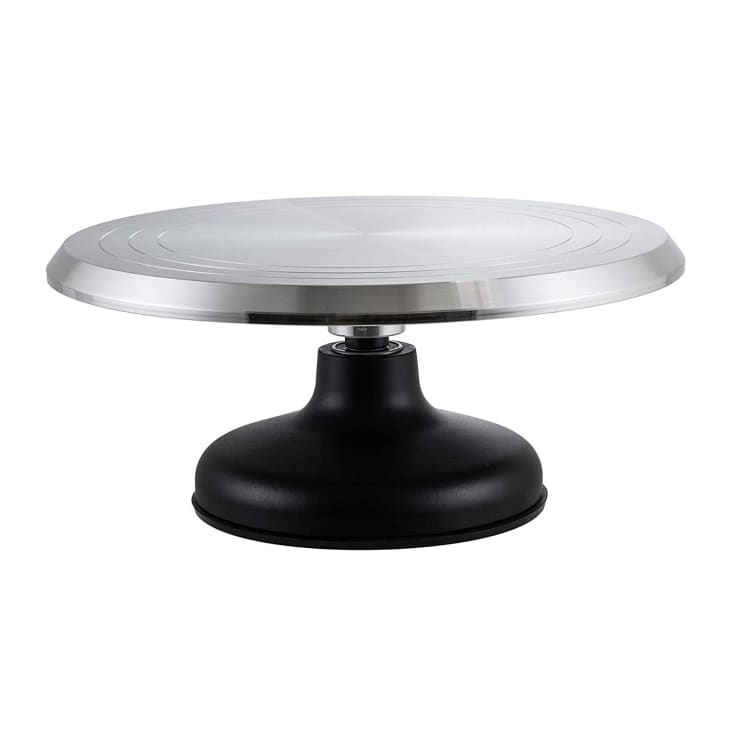 Cake stand with a black base and rotating stainless steal tray