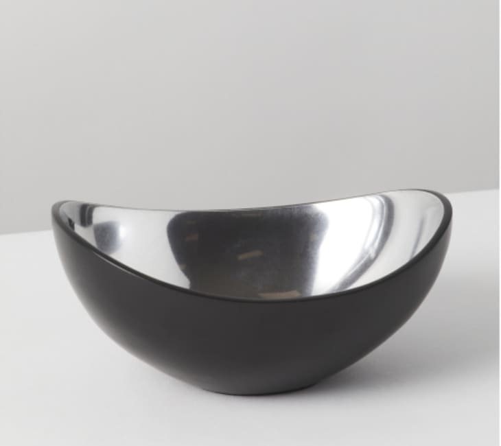 Curvy black decorative bowl with a matte outside and shiny inside