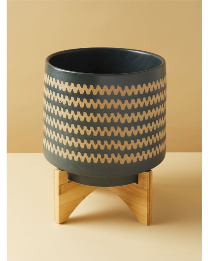 footed plant pot with a zig zg pattern