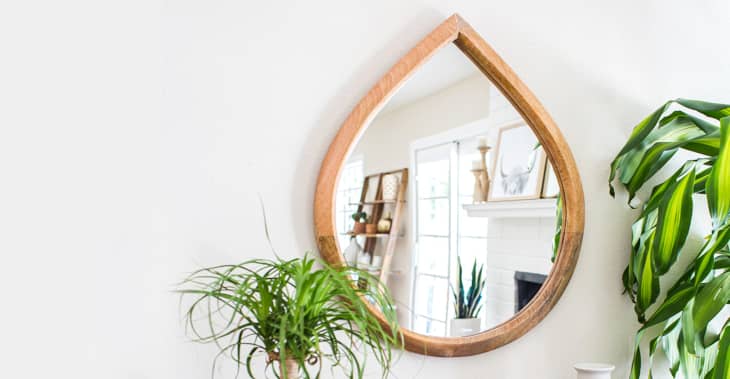 Wooden mirror shaped like a teardrop