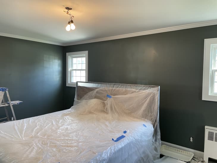 Process shot of painting gray bedroom