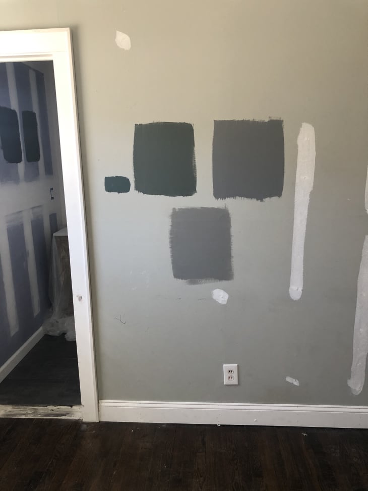 Gray paint swatches on a wall