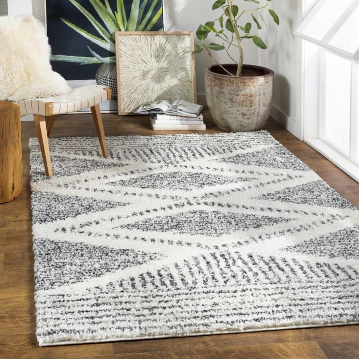 Black and White rug with diamond motif made out of hash mark stripes