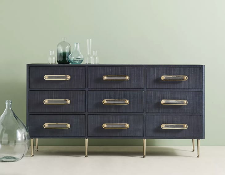 Navy dresser with tone on tone hash mark scoring on drawer surface from Anthropologie