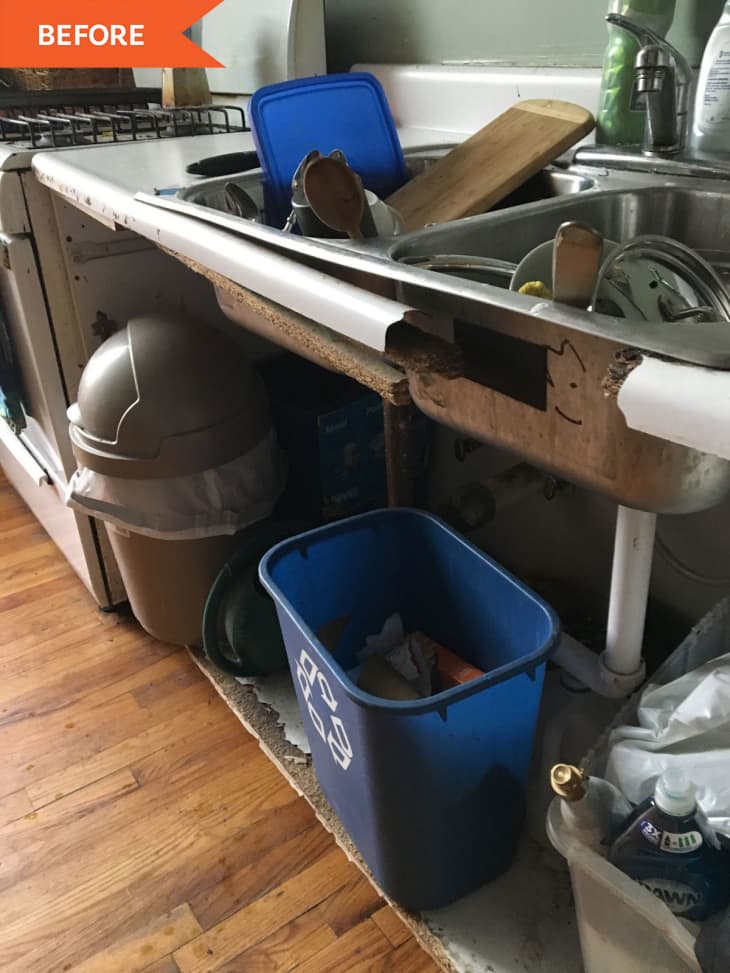 old kitchen sink with dishes and garbage