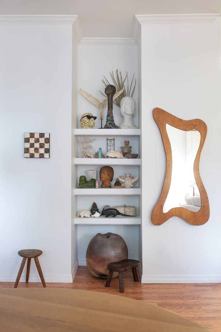 Thrifted wishbone mirror in Virginia Chamlee's home