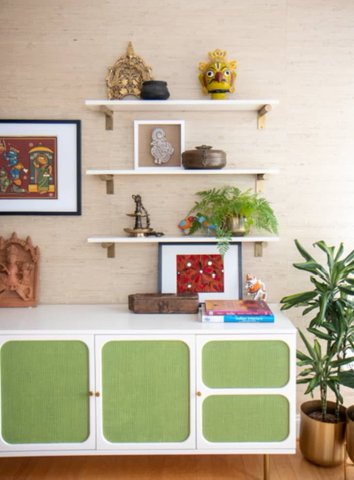 Interior with shelving and green console designed by Mitesh Trambadia
