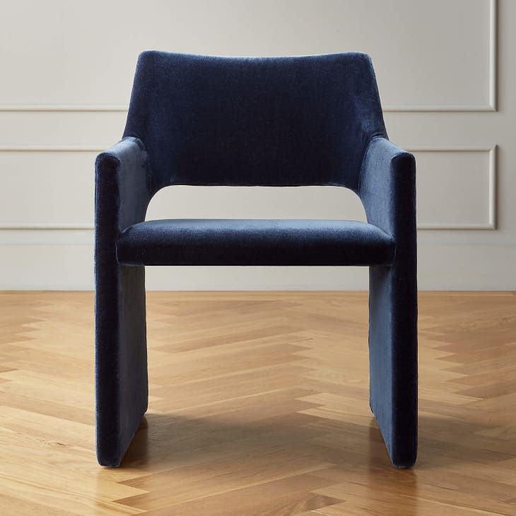 Dining chair from CB2 upholstered in navy faux mohair fabirc