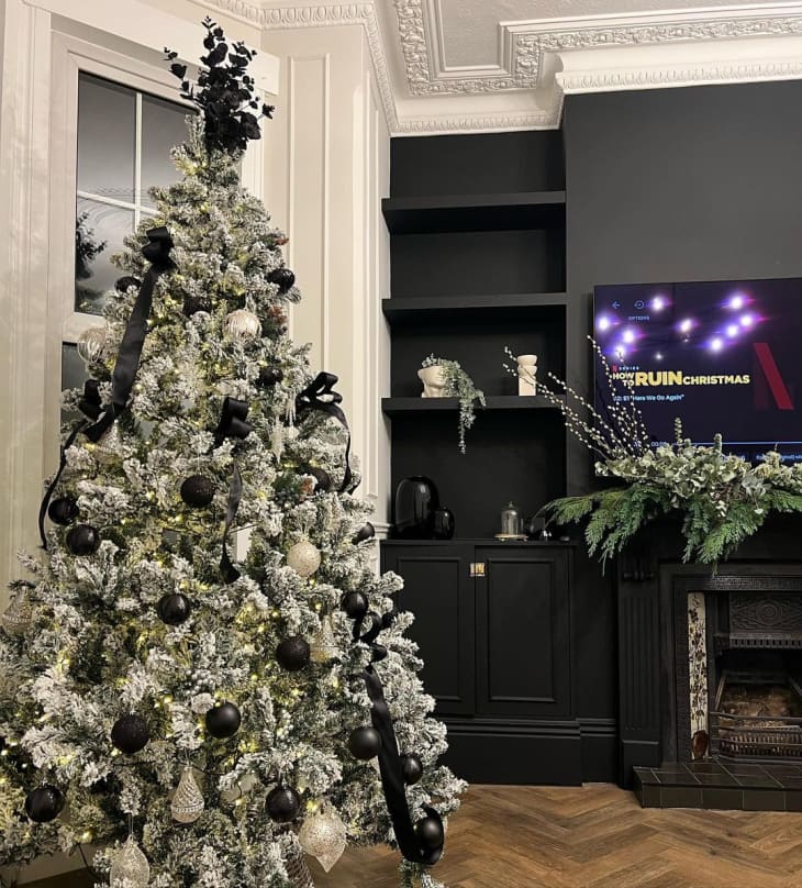 christmas tree with black ribbon in living room