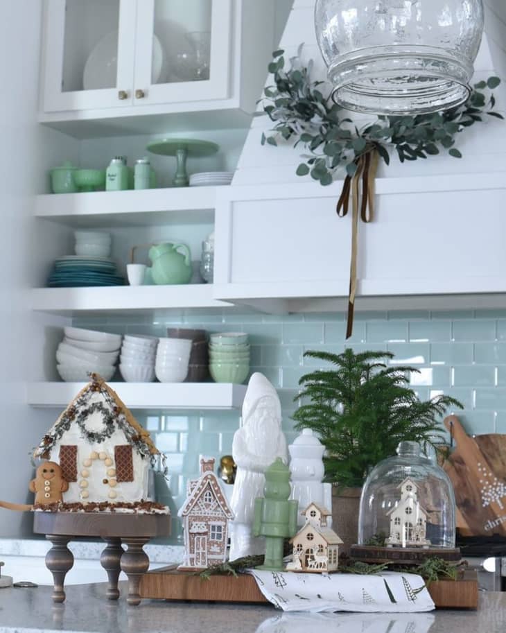 christmas decorations on kitchen countertop with blue backsplash