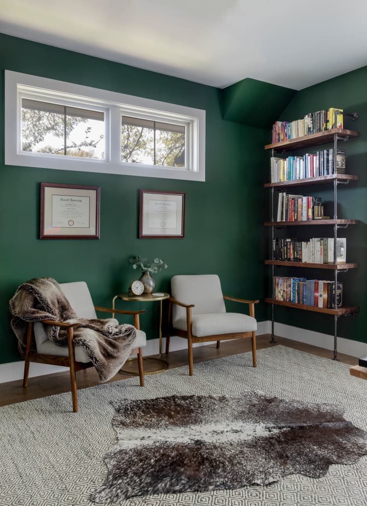 living room with green wallpaper