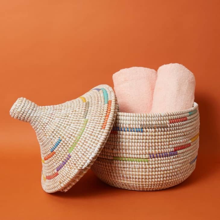 A woven basket on an orange background