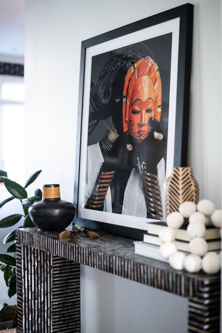 Vignette in the living area with art work and a console table designed by Marie Clloud of 
Indigo Pruitt