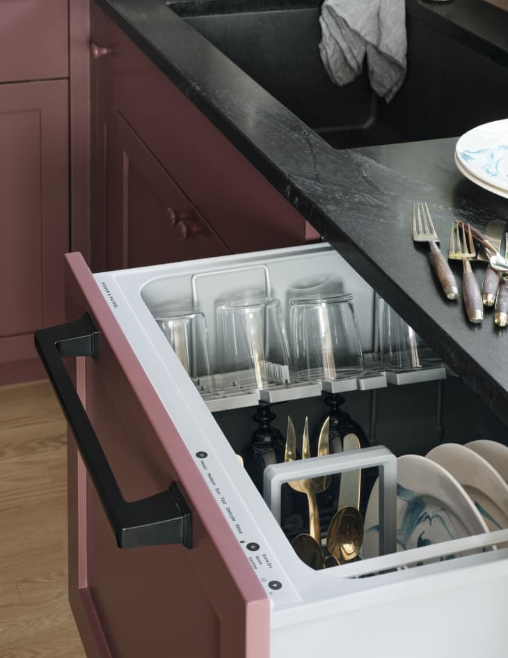 concealed dishwasher from Fisher &amp; Paykel in Sophie Donelson's kitchen with cranberry cabinetry